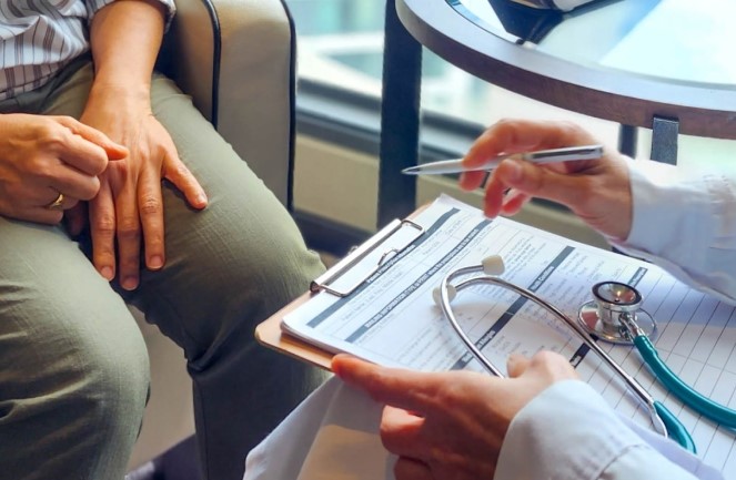 Practitioner consulting a patient
