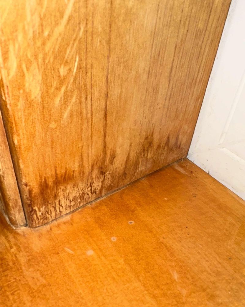 Staining on a wooden window frame.