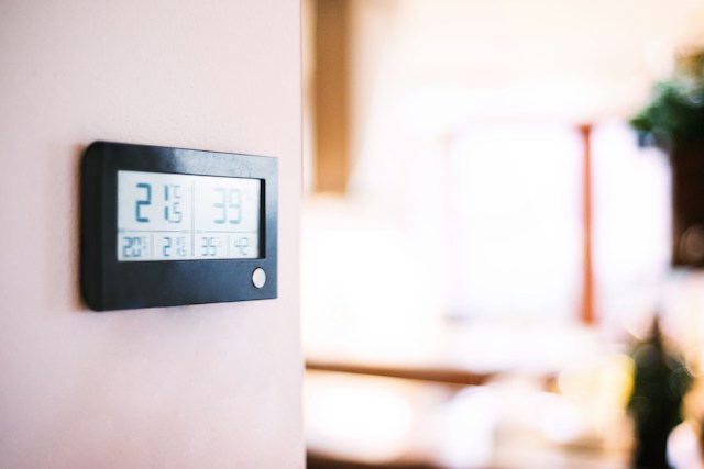 Wall-mounted hygrometer showing indoor temperature and humidity Wall-mounted hygrometer showing indoor temperature and humidity